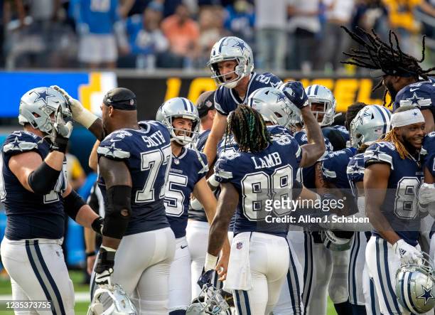 Los Angeles, CA Dallas Cowboys celebrate and hoist kicker Greg Zuerlein up high after Zuerlein kicked a 56 Yd field goal to beat the Los Angeles...