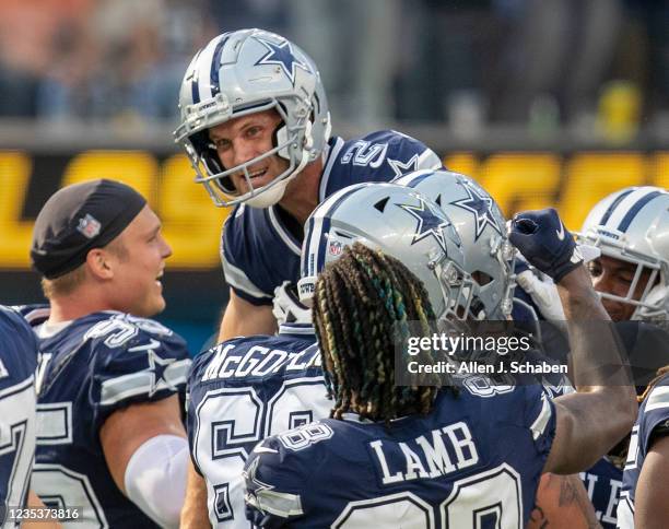 Los Angeles, CA Dallas Cowboys celebrate and hoist kicker Greg Zuerlein up high after Zuerlein kicked a 56 yard field goal to beat the Los Angeles...