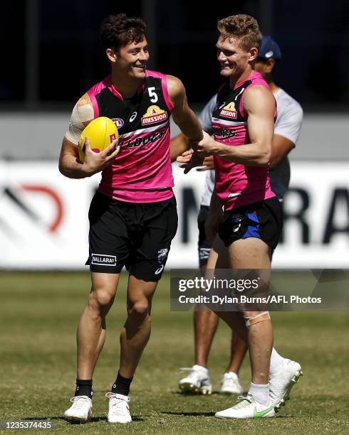Josh Dunkley of the Bulldogs and Adam Treloar of the Bulldogs are seen during the Western Bulldogs training session at Mineral Resources Park on...