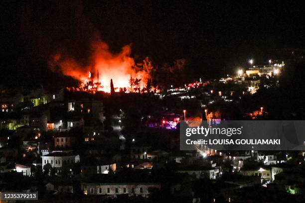 Photograph shows a fire, at the "jungle" part of the RIC for migrants and refugees, above the town of Vathy, on the island of Samos late on September...