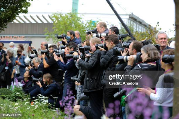 Press photographers take photograph of Dame Judi Dench with Chelsea pensioners during press day for the RHS Chelsea Flower Show, a garden show held...