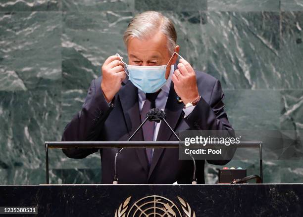 Secretary General Antonio Guterres removes his face mask before he speaks at the SDG Moment event as part of the UN General Assembly 76th session...