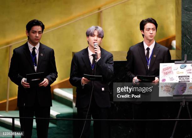 Taehyung/V, Suga and Jin of South Korean boy band BTS take turns speaking at the SDG Moment event as part of the UN General Assembly 76th session...