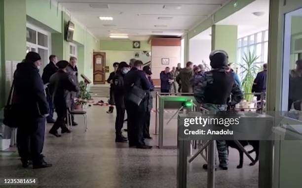 Screen grab captured from a video shows officials inspecting the scene after at least eight people were reported killed and several others injured...