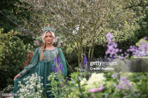 Model poses for photograph during press day for the RHS Chelsea Flower Show, a garden show held by the Royal Horticultural Society in the grounds of...