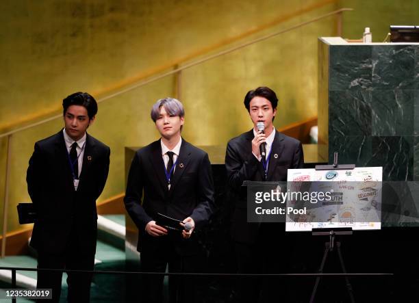 Taehyung/V, Suga and Jin of South Korean boy band BTS take turns speaking at the SDG Moment event as part of the UN General Assembly 76th session...