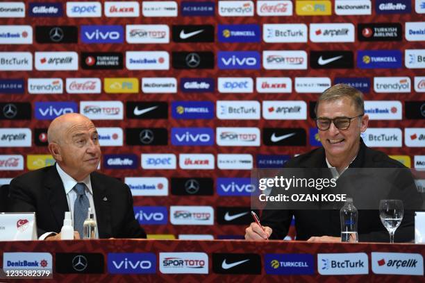 Turkey national football team's newly appointed, German head coach Stefan Kuntz , flanked by Turkish football federation president Nihat Ozdemir ,...