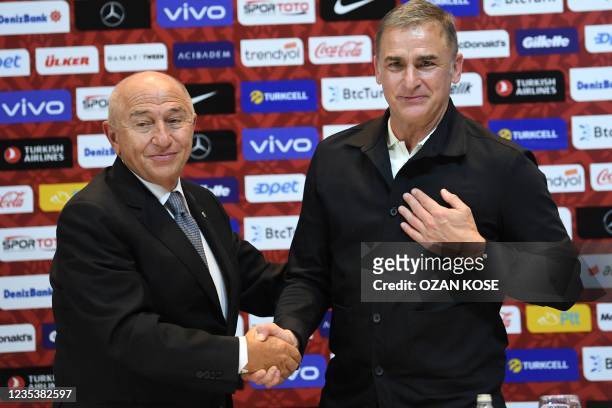 Turkey national football team's newly appointed, German head coach Stefan Kuntz , shakes hands with Turkish football federation president Nihat...