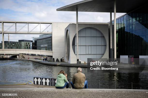 Visitors on the banks of the River Spree opposite the German chancellery in Berlin, Germany, on Monday, Sept. 20, 2021. Chancellor Merkels bloc has...