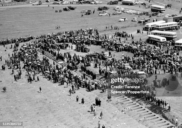 Bodies arrive on the back of flat bed trucks to be buried in a graveyard near the township of Sharpeville in Transvaal, South Africa following the...