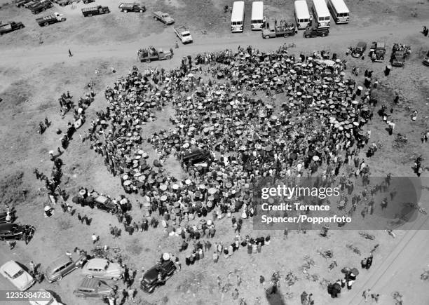 Bodies arrive on the back of flat bed trucks to be buried in a graveyard near the township of Sharpeville in Transvaal, South Africa following the...