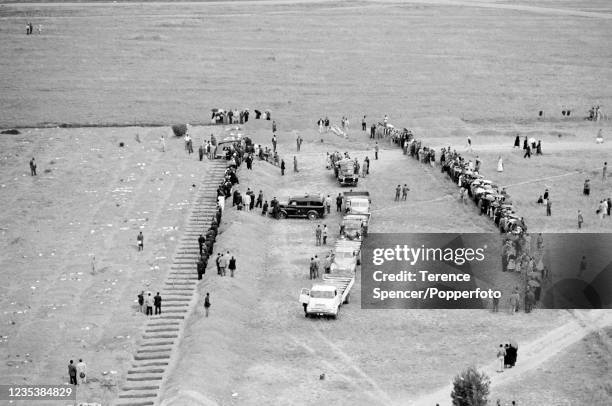 Bodies arrive on the back of flat bed trucks to be buried in a graveyard near the township of Sharpeville in Transvaal, South Africa following the...