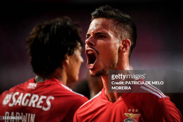 Benfica's German midfielder Julian Weigl celebrates with his teammate Benfica's Uruguayan forward Darwin Nunez after scored against Boavista FC...