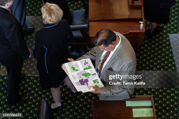 Texas state Sen. Eddie Lucio Jr., D-Brownsville, looks at a map of state Senate districts in the Senate chamber on the first day of the 87th...