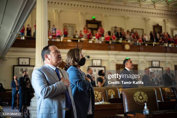 Texas state representatives recite the pledge of allegiance in the House chamber at the start of the 87th Legislature's third special session at the...