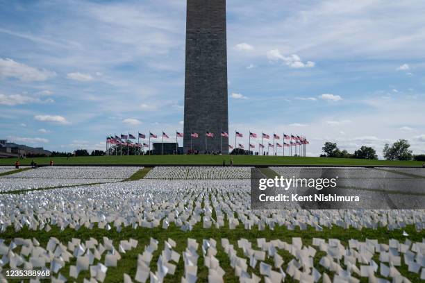 The Washington monument sits as a backdrop to the 'In America: Remember' public art installation near on the National Mall on Monday, Sept. 20, 2021...