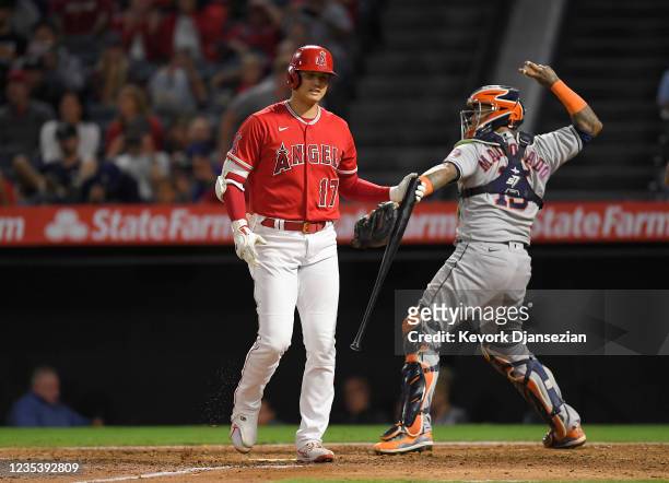 Shohei Ohtani of the Los Angeles Angels reacts after striking out against starting pitcher Framber Valdez of the Houston Astros during the sixth...