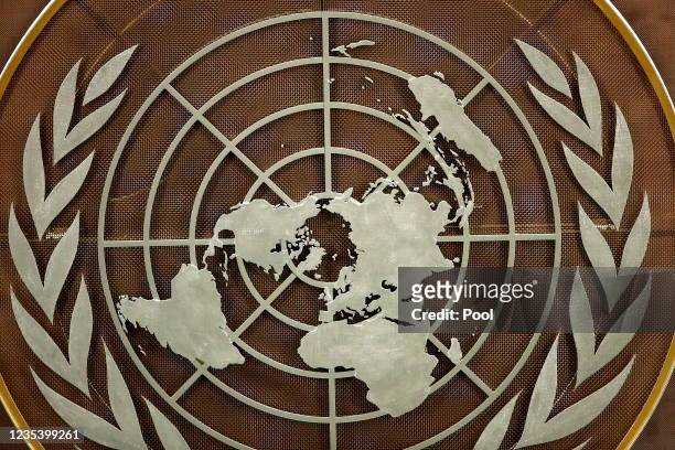 The logo of the United Nations is seen in the General Assembly hall before heads of state begin to address the 76th Session of the U.N. General...