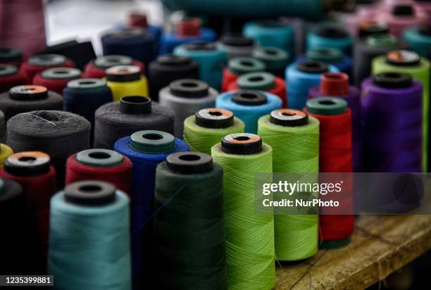 Yarn spools seen for produce sport jerseys at Zenith Apparel in Bogor, West Java, Indonesia, on September 21, 2021. As Indonesia government continues...