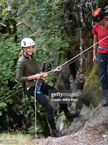 Catherine, Duchess of Cambridge abseils during a visit to the Windermere Adventure Training Centre with RAF Cadets on September 21,2021 in...