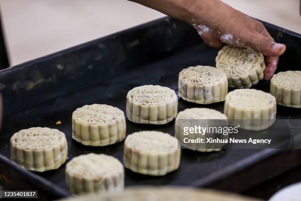 Chef makes mooncakes at a Chinese restaurant in Chinatown in Manila, the Philippines, Sept. 17, 2021. The Mid-Autumn Festival has become one of the...