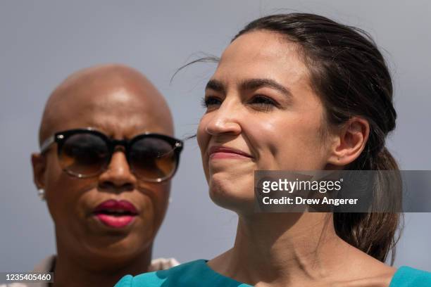 Rep. Ayanna Pressley and Rep. Alexandria Ocasio-Cortez attend a news conference to introduce legislation that would give the Department of Health and...