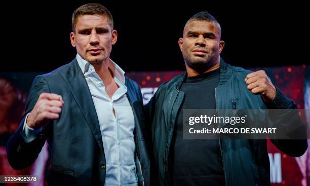 Dutch kickboxer Rico Verhoeven poses with Dutch kickboxer Alistair Overeem during a press presentation ahead of their first fight in Utrecht on...