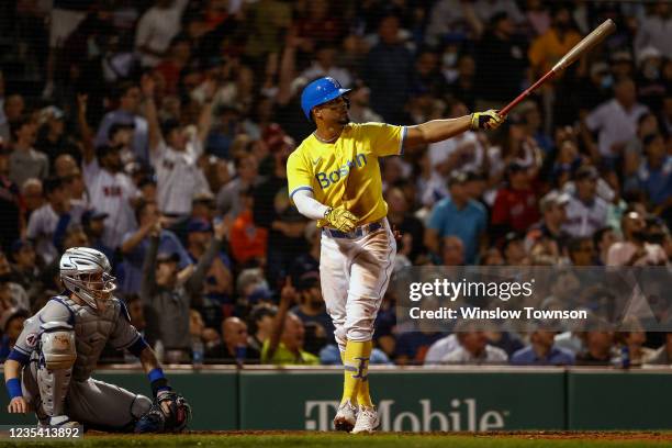 Xander Bogaerts of the Boston Red Sox watches his hit go for a two-run home run against the New York Mets during the fifth inning at Fenway Park on...