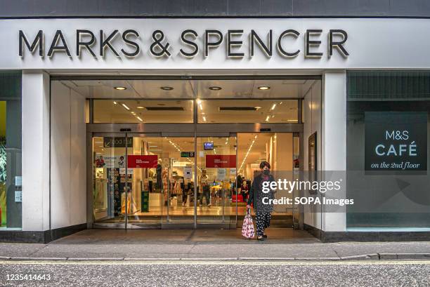 Shopper leaves Marks & Spencer Store on Callender Street, Belfast.