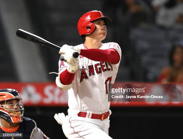 Shohei Ohtani of the Los Angeles Angels hits his 45th home run of the season in the eighth inning of the game against the Houston Astros at Angel...