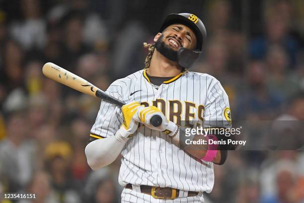 Fernando Tatis Jr. #23 of the San Diego Padres reacts after striking out during the ninth inning of a baseball game against the San Francisco Giants...