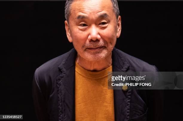 Japanese writer Haruki Murakami attends a press conference during a media preview of The Waseda International House of Literature, also known as...