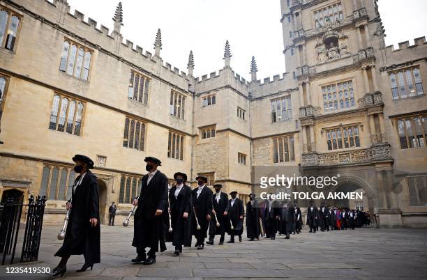 Honorands and senior University members take part in the annual Encaenia ceremony at Oxford University in Oxford, west of London, on September 22,...