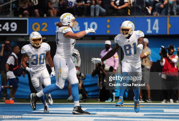 Los Angeles Chargers wide receiver Mike Williams runs towards Los Angeles Chargers offensive tackle Storm Norton after scoring a touchdown against...