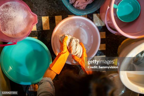 washing clothes by hands - washing tub stockfoto's en -beelden