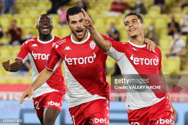 Monaco's French forward Wissam Ben Yedder celebrates with Monaco's German forward Kevin Volland after scoring a penalty during the French L1 football...