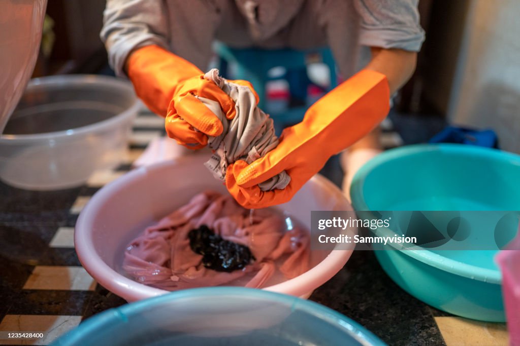 Washing clothes by hands