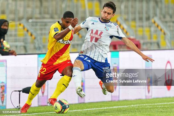 Wesley Said of RC Lens competes for the ball with Sanjin Prcic of Racing Club de Strasbourg during the Ligue 1 Uber Eats match between Lens and...
