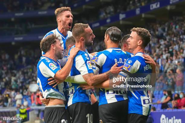 Raul de Tomas of RCD Espanyol celebrates with his teammates after scoring the 1-0 during the La Liga match between RCD Espanyol v Deportivo Alaves...