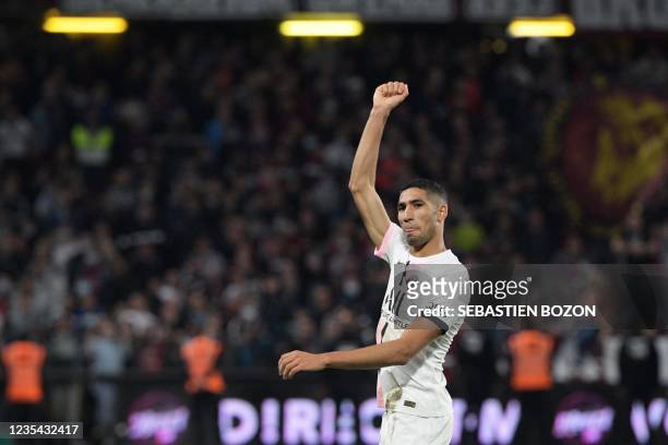 Paris Saint-Germain's Moroccan defender Achraf Hakimi celebrates after scoring his team's second goal during the French L1 football match between FC...