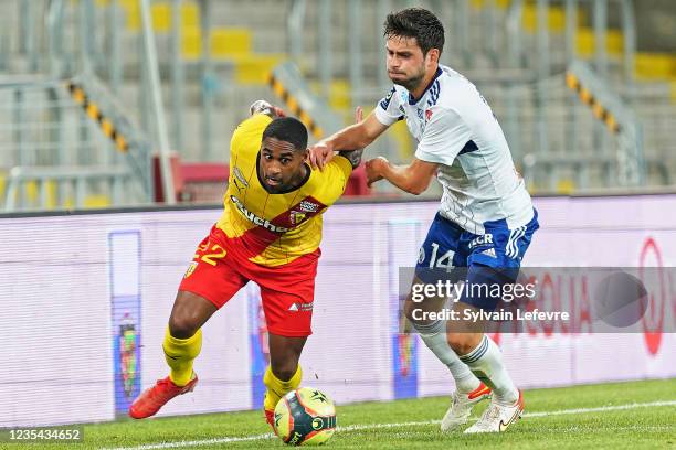 Wesley Said of RC Lens competes for the ball with Sanjin Prcic of Racing Club de Strasbourg during the Ligue 1 Uber Eats match between Lens and...