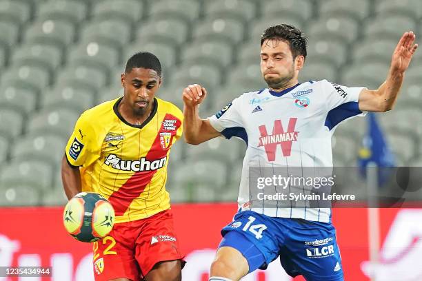 Wesley Said of RC Lens competes for the ball with Sanjin Prcic of Racing Club de Strasbourg during the Ligue 1 Uber Eats match between Lens and...