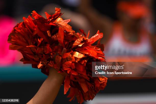 Miami Hurricanes cheerleader holds her pom-pom during the football game on September 18 at Hard Rock Stadium in Miami Gardens, Florida.