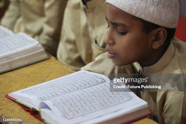 Muslim student learns to recite the Quran in a 'Madrasa', a religious school for the study of the Islam, After several months of Covid-19 lockdown,...