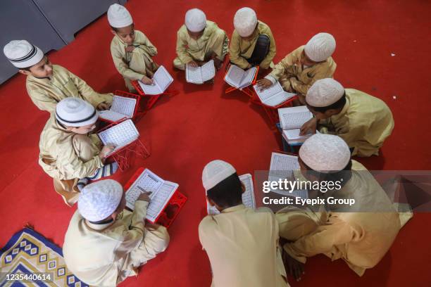 Muslim students learn to recite the Quran in a 'Madrasa', a religious school for the study of the Islam, After several months of Covid-19 lockdown,...