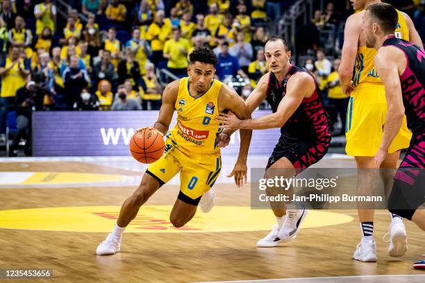 Maodo Lo of Alba Berlin and Karsten Tadda of Telekom Baskets Bonn during the Basketball Bundesliga match between ALBA Berlin against the Telekom...