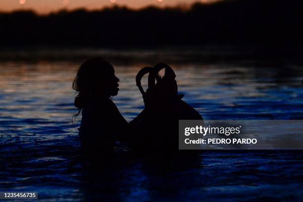 Haitian migrant crosses the Rio Grande river, as seen from Ciudad Acuna, Coahuila state, Mexico on September 23, 2021. - Deportation fears mounted...