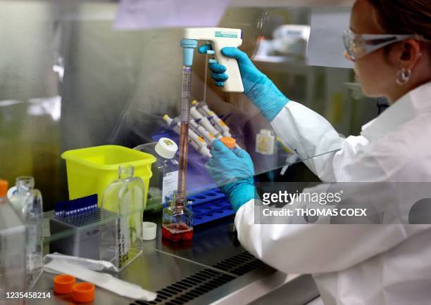 Lab technician works on a research process to find new CAR-T cells and RNA in the laboratory of French biopharmaceutical company Cellectis in Paris...