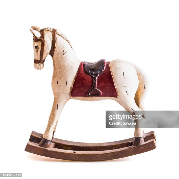 vintage antique rocking toy horse ornament isolated on white background - christmas toys wooden background foto e immagini stock