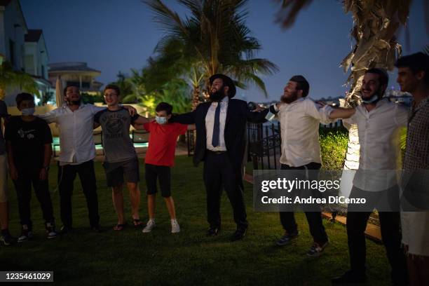 Rabbi Levi Duchman and student rabbis from CTeen International dance and chant during the first Sukkot Hop to be held in the United Arab Emirates on...